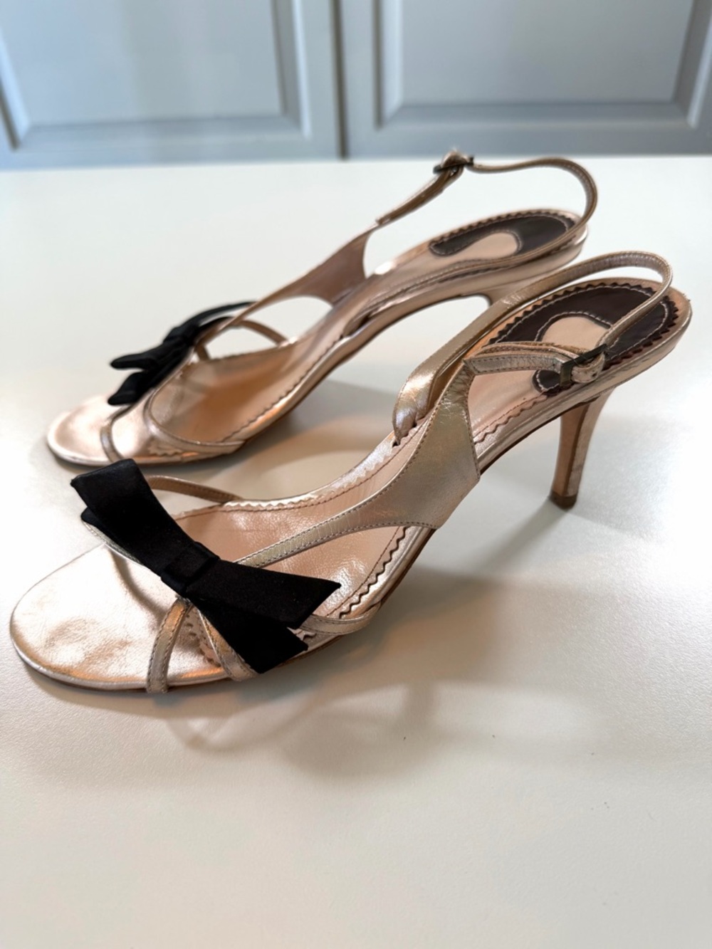 Chloé Metallic Gold Slingback Sandals with Black Bow